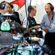 Ron Dennis (in grey) speaking with members of the McLaren Formula One team. Photo credit: Charles Coates/Getty Images